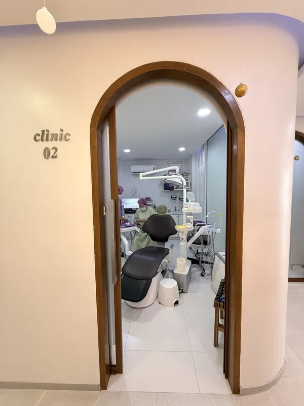 An arched doorway into a treatment room at the clinic